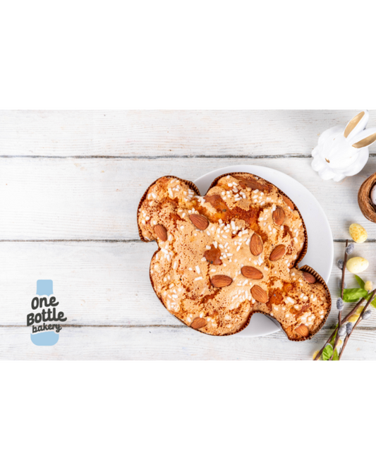 raditional Italian Colomba di Pasqua Easter bread on table, dove-shaped cake