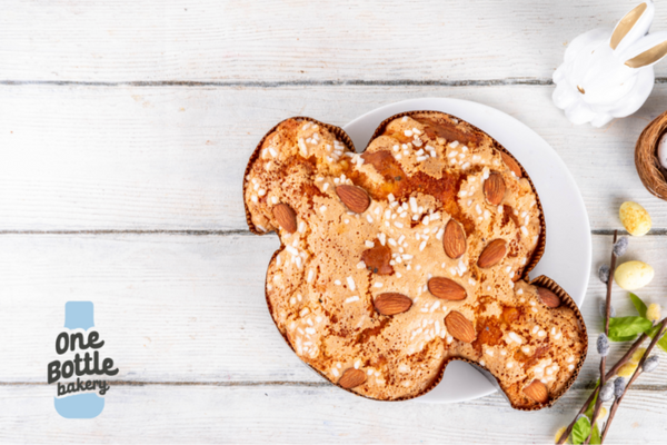 Traditional Italian Colomba di Pasqua Easter bread on table, dove-shaped cake