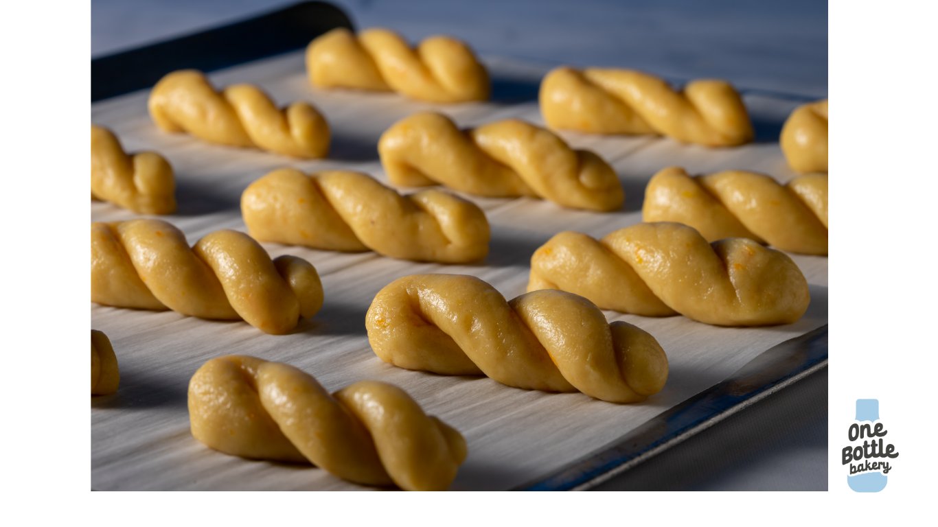 Traditional Greek Easter koulourakia cookies unbaked on tray, ready for oven