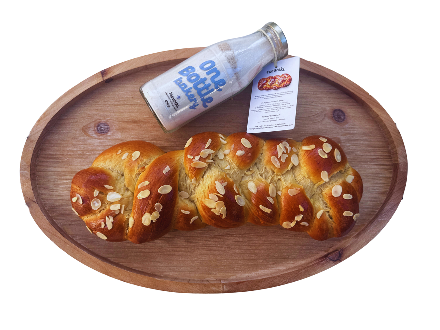 One Bottle Bakery tsoureki Greek Easter bread mix in Canada with freshly baked braided tsoureki bread and glass bottle baking mix